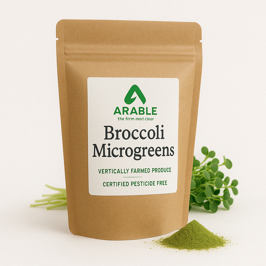 Arable Broccoli Microgreens powder pouch with fresh microgreens and green powder, labeled vertically farmed and certified pesticide-free