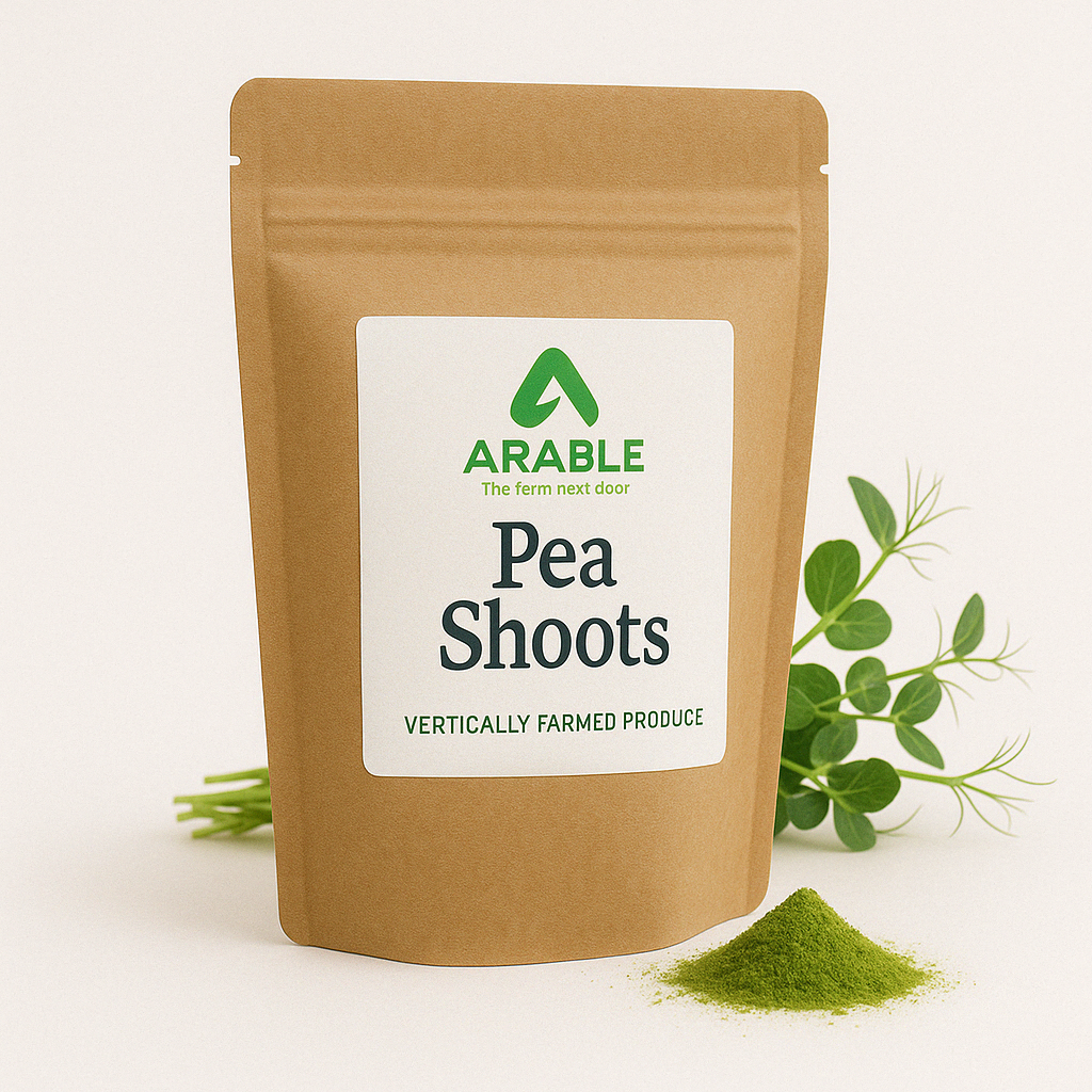 Arable Pea Shoots microgreens powder pouch with fresh pea shoots and vibrant green powder, labeled vertically farmed produce